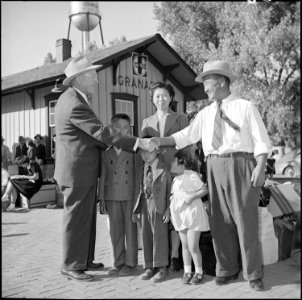 Granada Relocation Center, Amache, Colorado. Mr. B. Wakatani saying Goodbye to Mr. James G. Lindl . . . - NARA - 539902