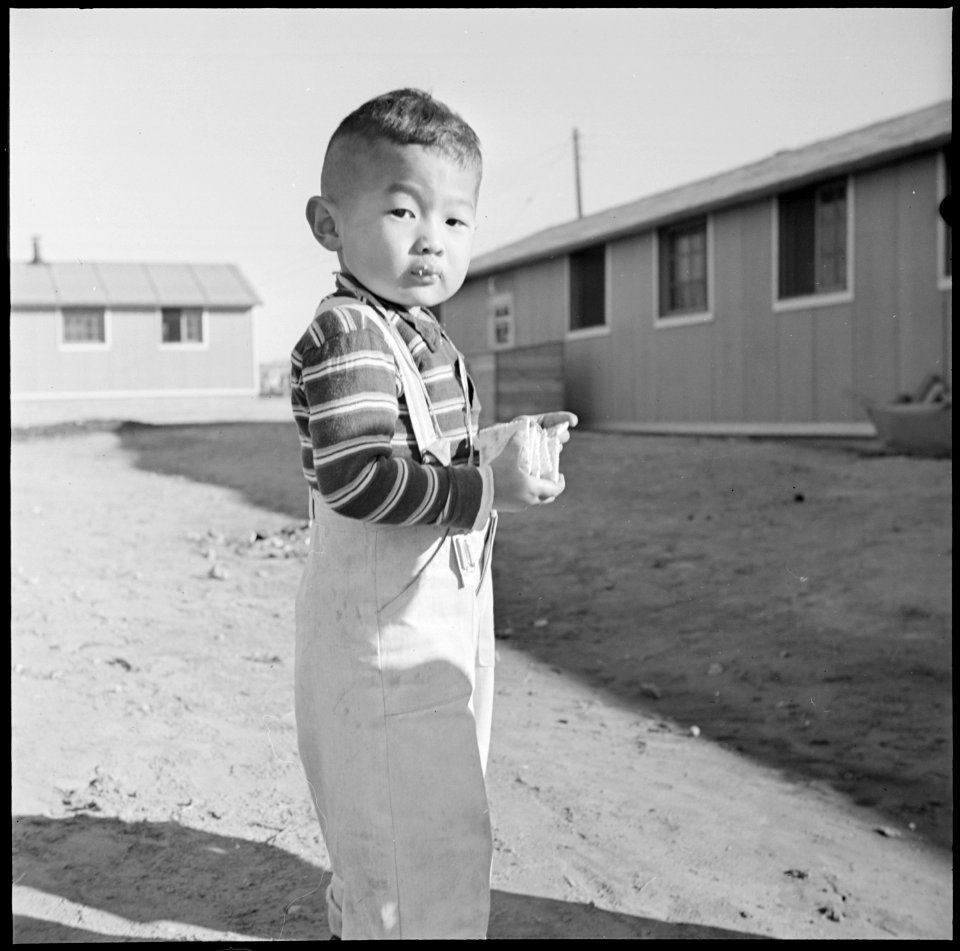 Granada Relocation Center, Amache, Colorado. It is a long time between meals at the mess hall for a . . . - NARA - 539091