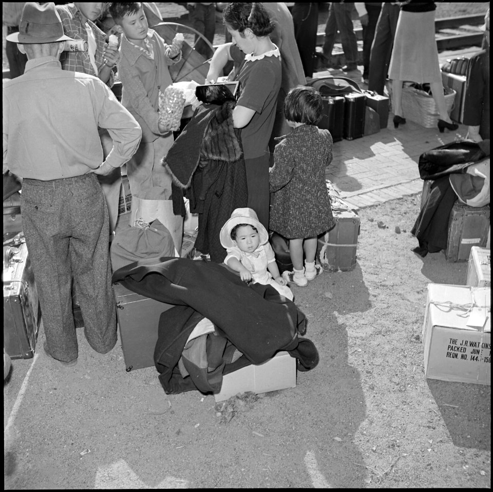 Granada Relocation Center, Amache, Colorado. Shown here is a young miss, dressed in her Sunday best . . . - NARA - 539908