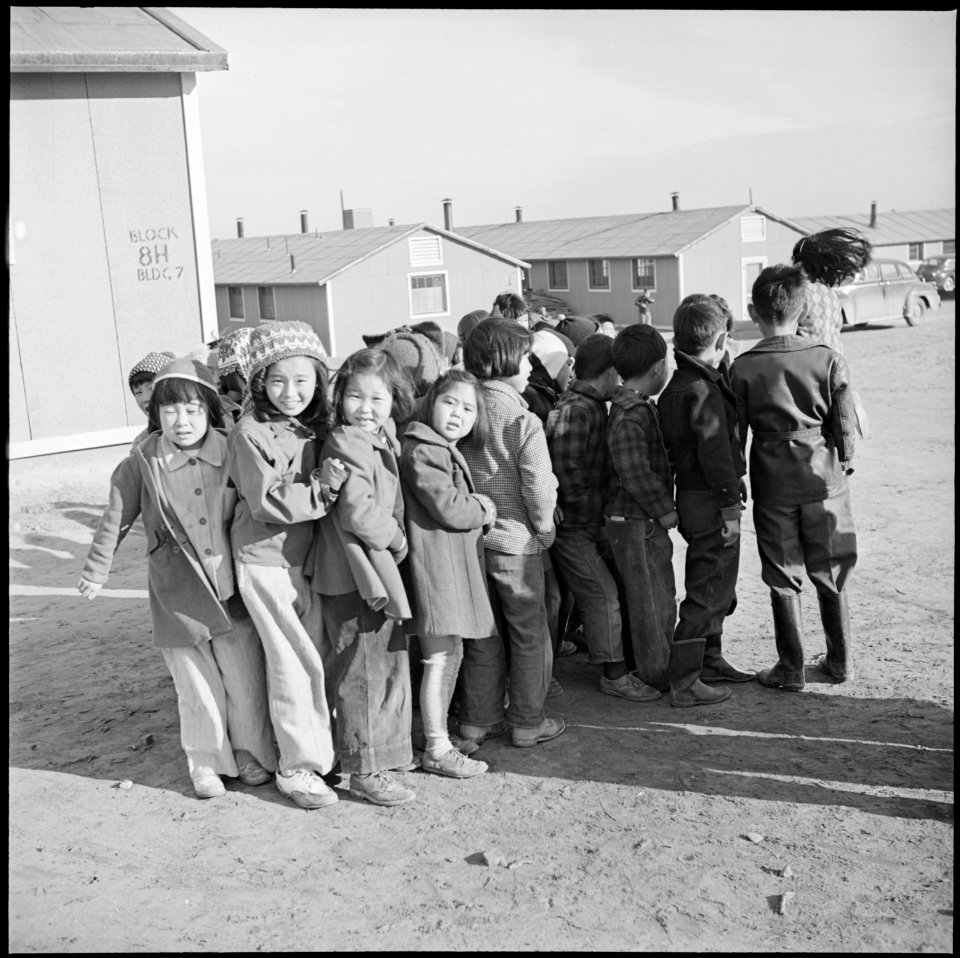 Granada Relocation Center, Amache, Colorado. Primary school children line up for a racing game on t . . . - NARA - 539112
