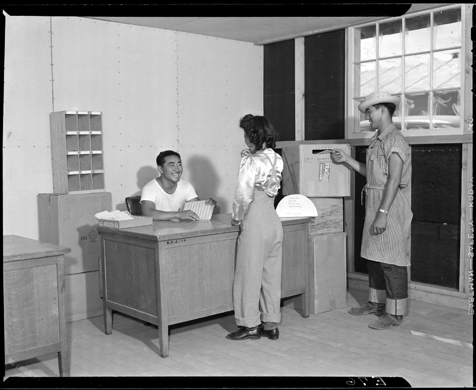 Granada Relocation Center, Amache, Colorado. Temporary Post Office did a rushing business as first . . . - NARA - 538739
