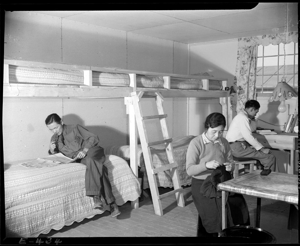 Granada Relocation Center, Amache, Colorado. The Ninomiya family in their barracks room at the Amac . . . - NARA - 539011