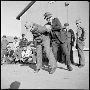 Granada Relocation Center, Amache, Colorado. Police Chief Tomilnson, demonstrates to a class of vol . . . - NARA - 539102