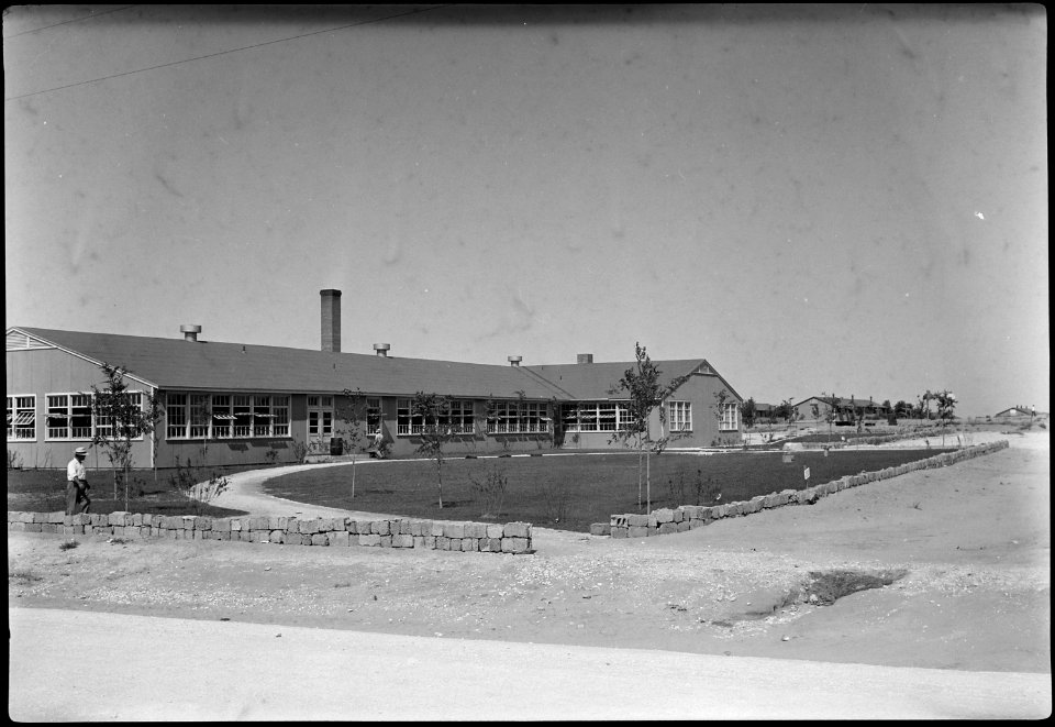 Granada Relocation Center, Amache, Colorado. South entrance, Amache High School. - NARA - 539571