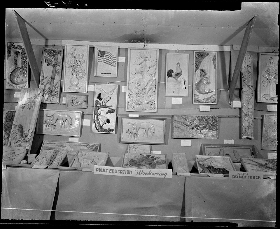 Granada Relocation Center, Amache, Colorado. The woodcarvings on this exhibit panel at the Arts and . . . - NARA - 539289