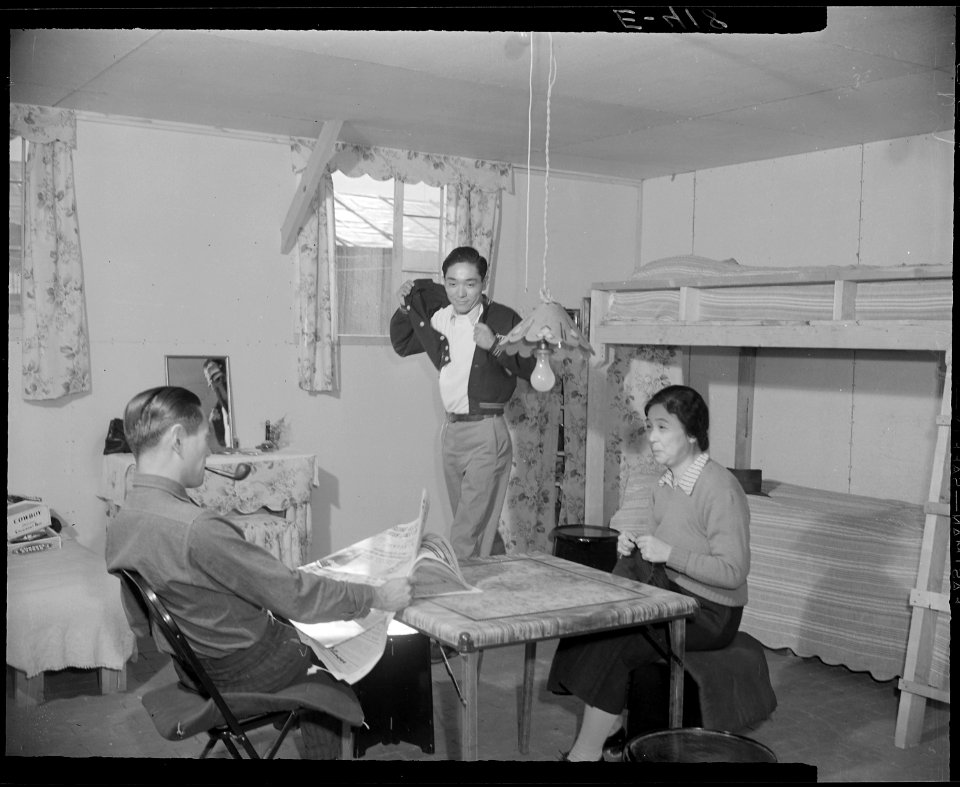 Granada Relocation Center, Amache, Colorado. The Ninomiya family in their barracks room at the Amac . . . - NARA - 538998