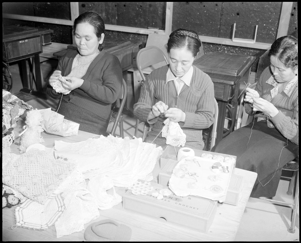 Granada Relocation Center, Amache, Colorado. Three members of an adult crocheting class. The instr . . . - NARA - 539033