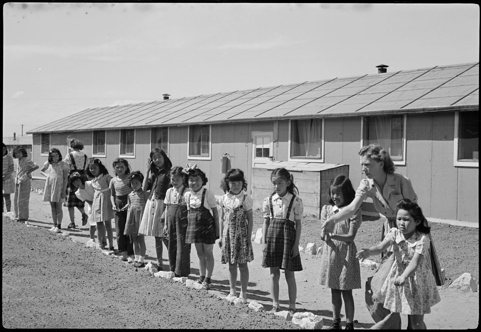 Granada Relocation Center, Amache, Colorado. View showing Elementary children landscaping the groun . . . - NARA - 539394