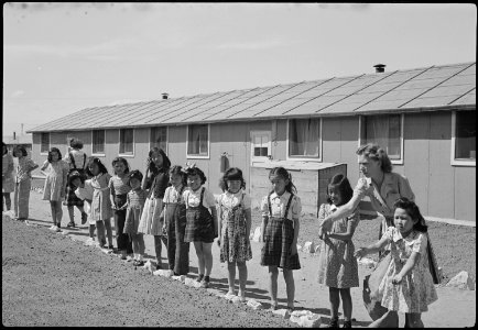 Granada Relocation Center, Amache, Colorado. View showing Elementary children landscaping the groun . . . - NARA - 539394