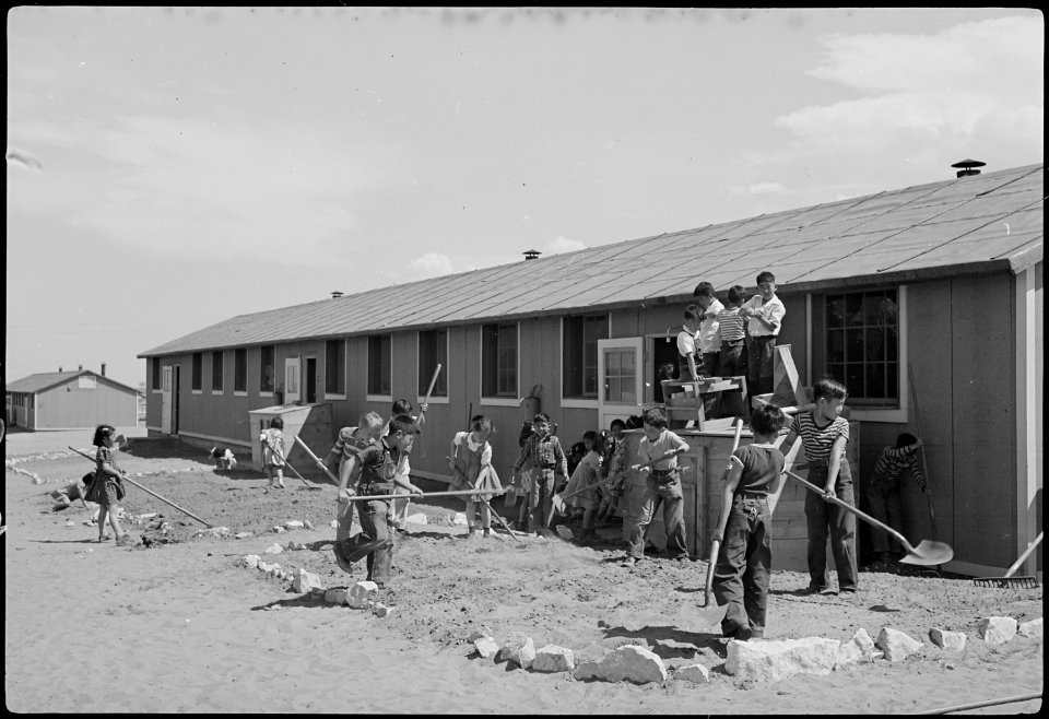 Granada Relocation Center, Amache, Colorado. View showing Elementary children landscaping the groun . . . - NARA - 539398