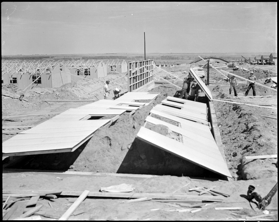 Granada Relocation Center, Amache, Colorado. Typical scene of barracks construction with the prefab . . . - NARA - 538732