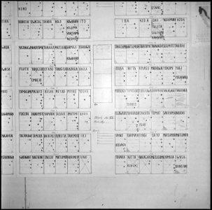 Granada Relocation Center, Amache, Colorado. Wall charts show residence of every resident. A yello . . . - NARA - 539930