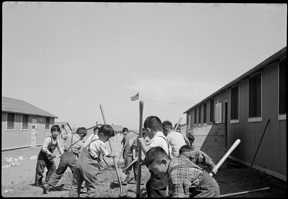 Granada Relocation Center, Amache, Colorado. View showing Elementary children landscaping the groun . . . - NARA - 539391