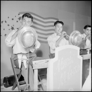 Granada Relocation Center, Amache, Colorado. Trumpet section of the Granada High School Band giving . . . - NARA - 539407
