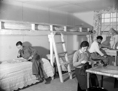 Granada Relocation Center, Amache, Colorado. The Ninomiya family in their barracks room at the Amac . . . - NARA - 539011
