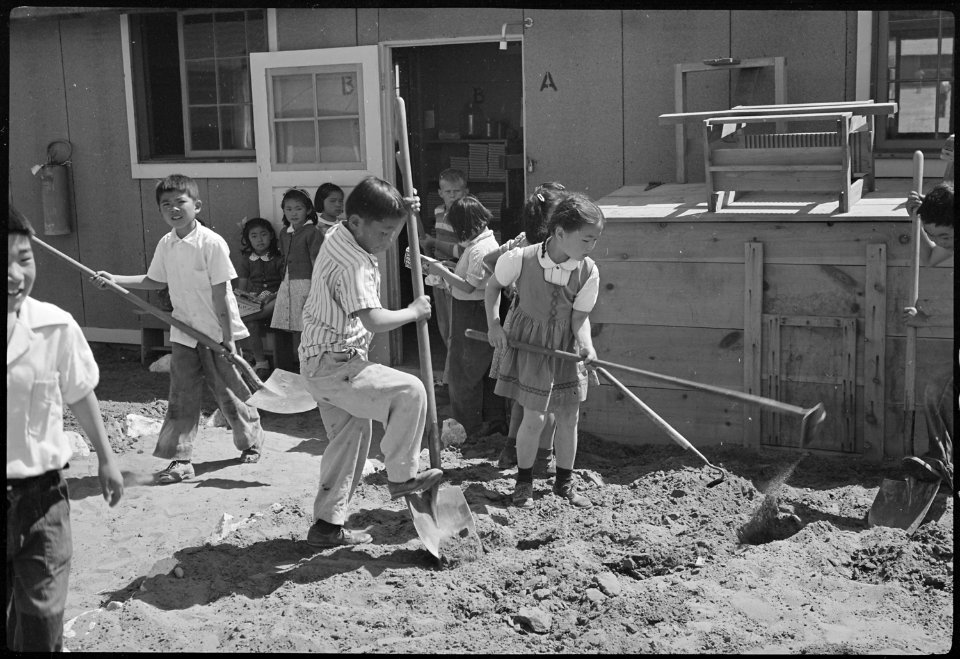Granada Relocation Center, Amache, Colorado. View showing Elementary children landscaping the groun . . . - NARA - 539397