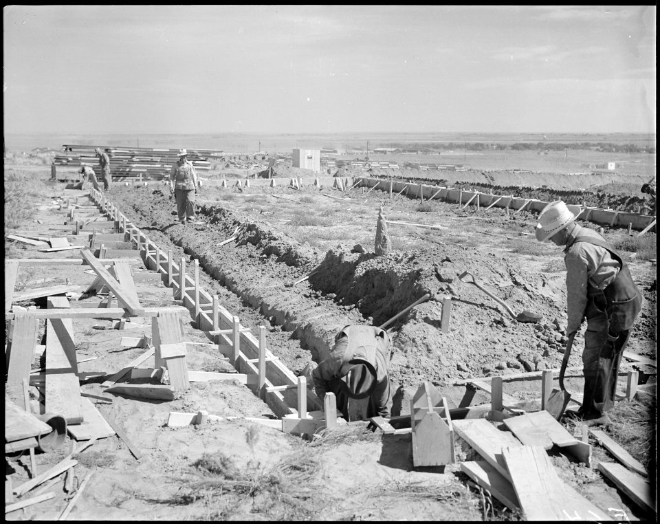 Granada Relocation Center, Amache, Colorado. Typical scene of the construction of the barracks. He . . . - NARA - 538728