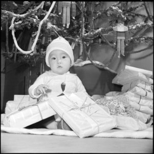 Granada Relocation Center, Amache, Colorado. Nine month old Takashi Yoshida symbolizes the spirit o . . . - NARA - 539414
