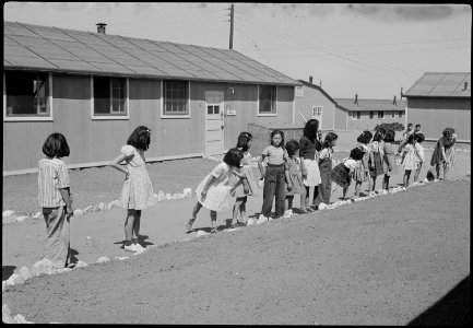 Granada Relocation Center, Amache, Colorado. View showing Elementary children landscaping the groun . . . - NARA - 539392