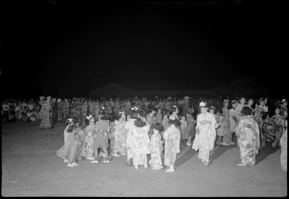 Granada Relocation Center, Amache, Colorado. young dancers line up for refreshments during intermis . . . - NARA - 537368