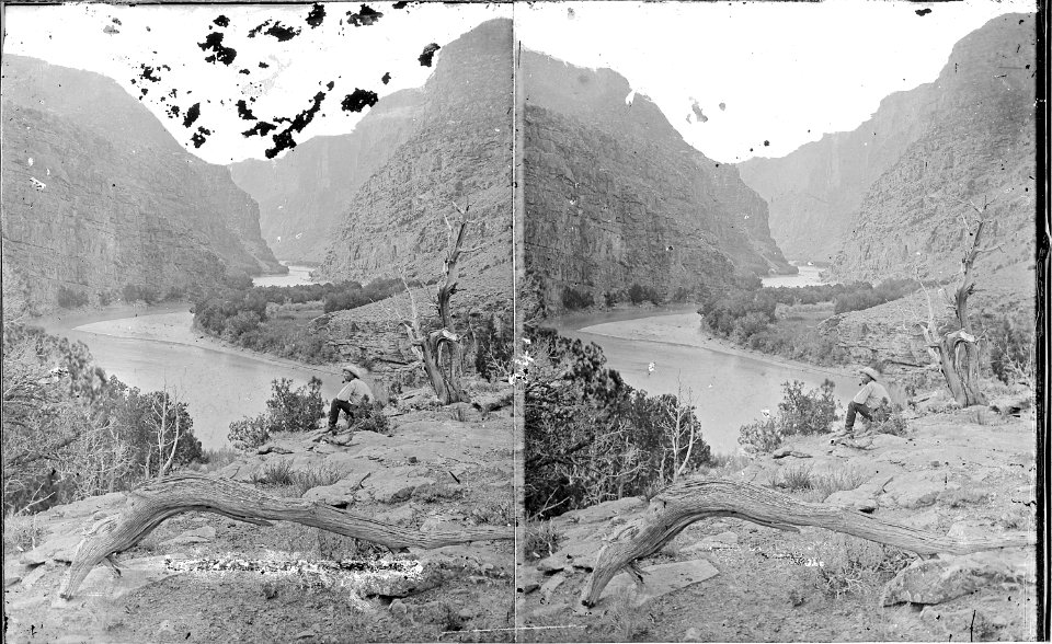 Green River, Canyon of Lodore. Just within the entrance. The man seated on the ground smoking a pipe - NARA - 517842
