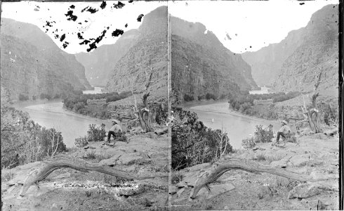 Green River, Canyon of Lodore. Just within the entrance. The man seated on the ground smoking a pipe - NARA - 517842