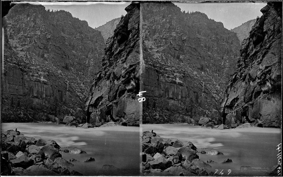 Green River. Canyon of Lodore, small figure of a man reading on left bank, possibly Clem Powell. See - NARA - 517888