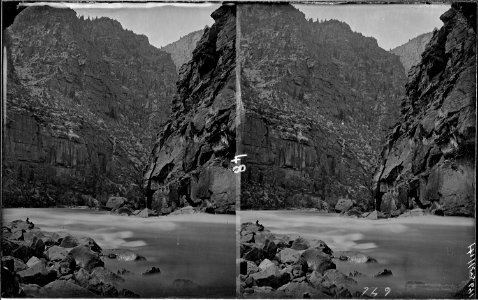 Green River. Canyon of Lodore, small figure of a man reading on left bank, possibly Clem Powell. See - NARA - 517888