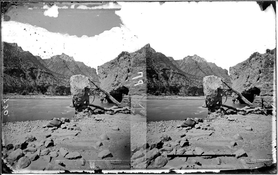 Green River. Split Mountain Canyon, cave at the right, not far from entrance to canyon. Prof. A.H. Thompson is... - NARA - 517935