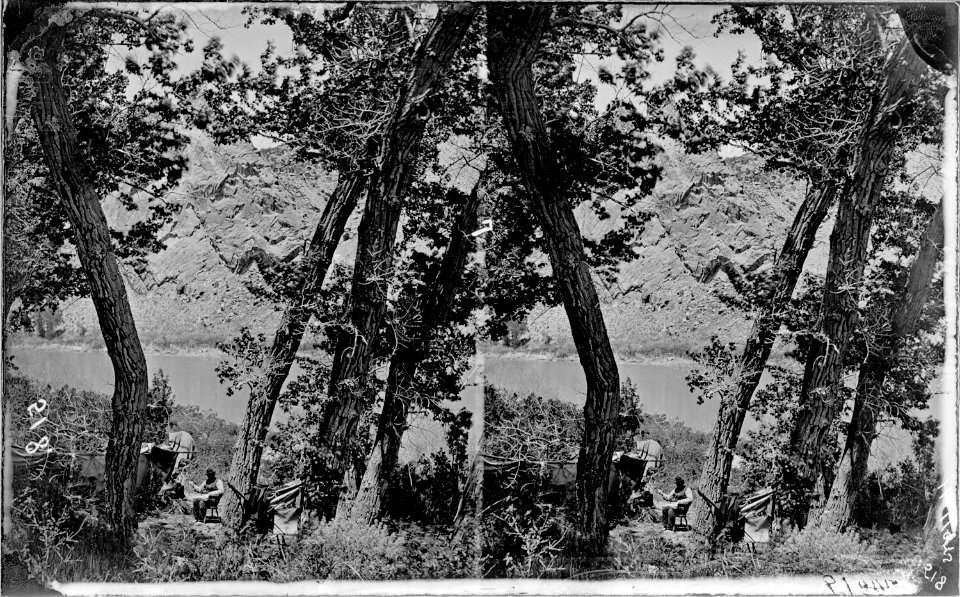 Green River. Red Canyon Park, Hillers sewing. For similar photo showing all the camp including the tent, see 559.... - NARA - 517849