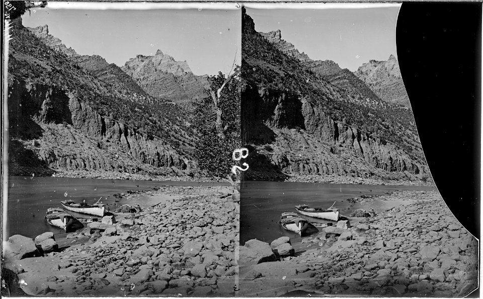 Green River. Split Mountain Canyon, not far from no. 694, above it. Photo shows two boats anchored, 1871 Expedition... - NARA - 517938