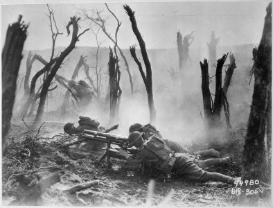 Gun crew from Regimental Headquarters Company, 23rd Infantry, firing 37mm gun during an advance against German... - NARA - 531005 photo