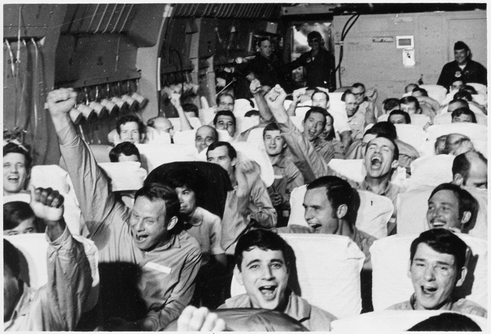 Hanoi, North Vietnam....American servicemen, former prisoners of war, are cheering as their aircraft takes off from... - NARA - 532510