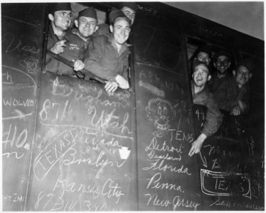 Happy veterans head for harbor of Le Havre, France, the first to be sent home and discharged under the Army's new... - NARA - 531298