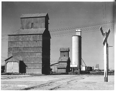 Haskell County, Kansas (Sublette). Grain elevators near the depot in Sublette. If there should be a . . . - NARA - 522073 photo