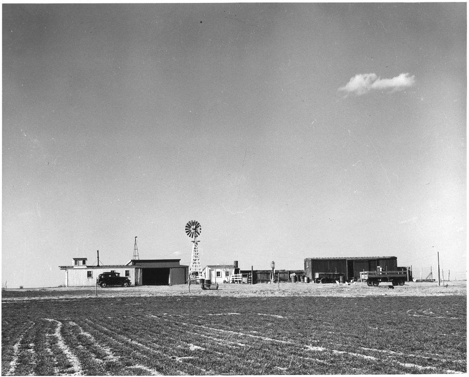Haskell County, Kansas. Other farm near Sublette. This is a farmstead made of box-cars and a caboose . . . - NARA - 522086