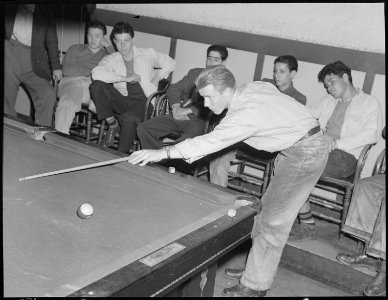 Hayward, California. Pool Recreation. A typical small town phenomenon, Saturday in the pool hall. The youths here are... - NARA - 532236 photo
