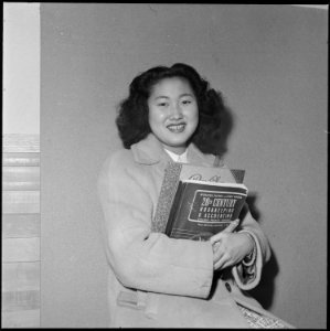 Heart Mountain Relocation Center, Heart Mountain, Wyoming. 16-year old Yoko Sato represents a typic . . . - NARA - 539729