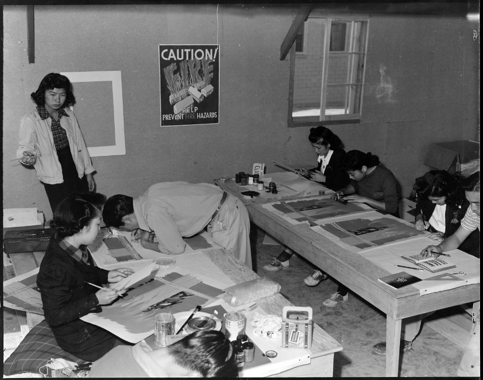 Heart Mountain Relocation Center, Heart Mountain, Wyoming. A crew of poster artists preparing Caut . . . - NARA - 538786