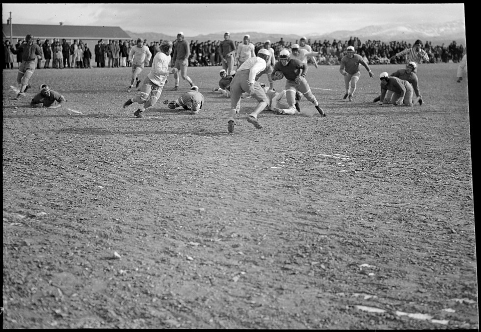 Heart Mountain Relocation Center, Heart Mountain, Wyoming. A fast bit of action in a game between t . . . - NARA - 539456