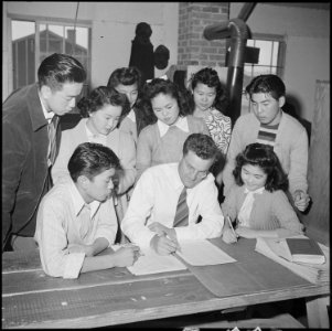 Heart Mountain Relocation Center, Heart Mountain, Wyoming. A part of the Echoes staff gathers f . . . - NARA - 537155