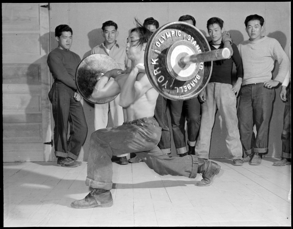 Heart Mountain Relocation Center, Heart Mountain, Wyoming. An instructor in the weight lifting clas . . . - NARA - 538763