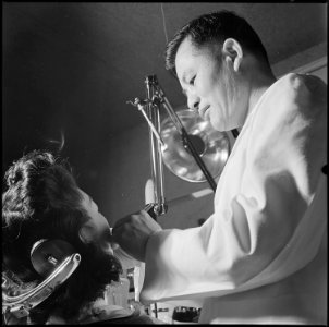Heart Mountain Relocation Center, Heart Mountain, Wyoming. Doctor T. Tanaka, one of the dentists at . . . - NARA - 539455