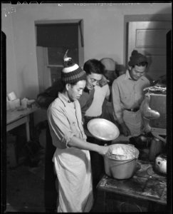 Heart Mountain Relocation Center, Heart Mountain, Wyoming. Hungry beet workers look over the should . . . - NARA - 538760