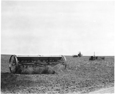 Haskell County, Kansas. Machinery is seldom housed. Sometimes it is not even brought back to the hou . . . - NARA - 522110 photo