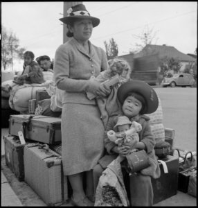 Hayward, California. These people of Japanese ancestry are awaiting the special bus which will take . . . - NARA - 537522