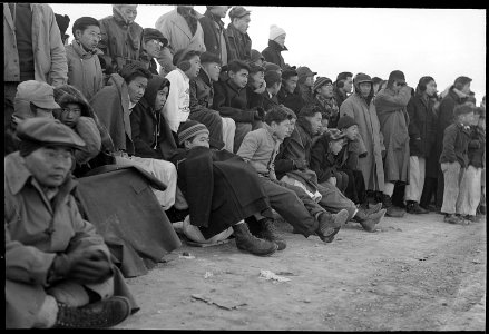 Heart Mountain Relocation Center, Heart Mountain, Wyoming. Football fans of Heart Mountain braved s . . . - NARA - 539465 photo