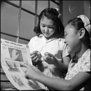 Heart Mountain Relocation Center, Heart Mountain, Wyoming. Joan Ritchie, left, and Janet Sakamoto, . . . - NARA - 539474 photo