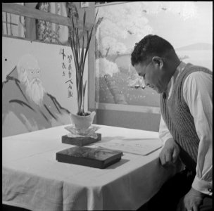 Heart Mountain Relocation Center, Heart Mountain, Wyoming. M. Imafuji amid the oriental decorations . . . - NARA - 539179