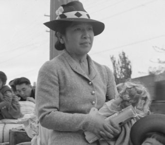 Hayward, California. These people of Japanese ancestry are awaiting the special bus which will take . . . - NARA - 537522 (cropped) photo